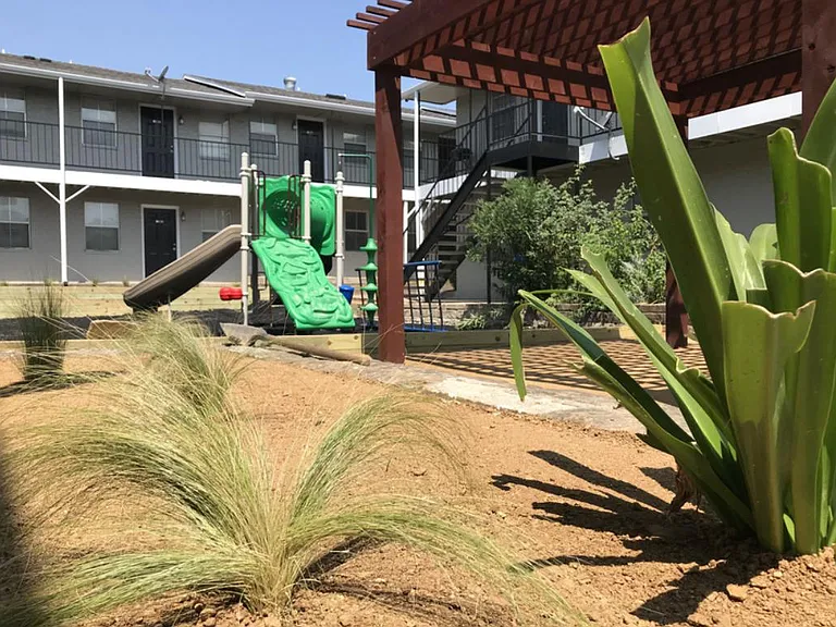 Playground and community courtyard at Polk Villas